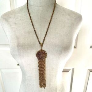 Gold tone long tassel necklace